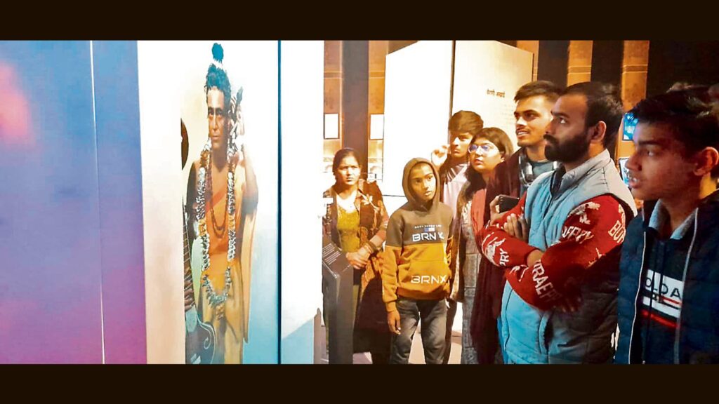 Pilgrims interact with ‘Narad Muni’ at Mahakumbh