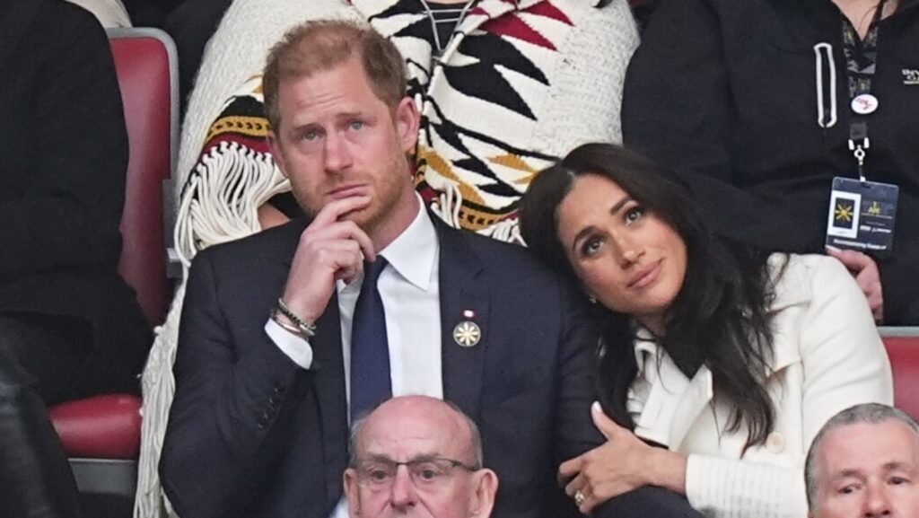 Prince Harry and Meghan heat up Invictus games with a kiss in the stands