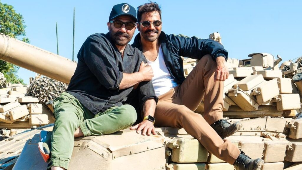 Varun Dhawan poses with Sunny Deol on a military tanker, shares pic from Border 2 set. See post | Bollywood
