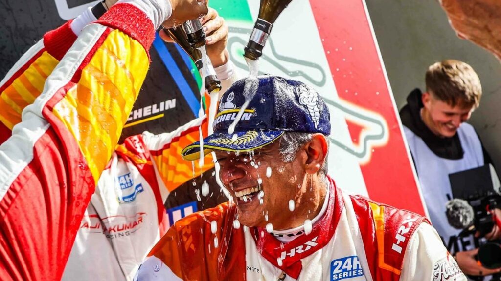 Ajith Kumar drenched in champagne by teammates after their win at 12H Mugello. Watch