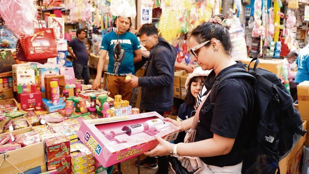 Holi shopping at Delhi’s Sadar Bazar: Hammer, been pichkari, flashy wigs, colourful clothes and more!