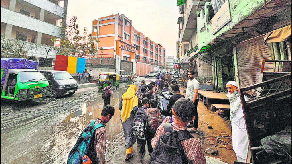 In Khajuri Khas, kids forced to wade through sewage to go to Delhi govt school | Latest News Delhi