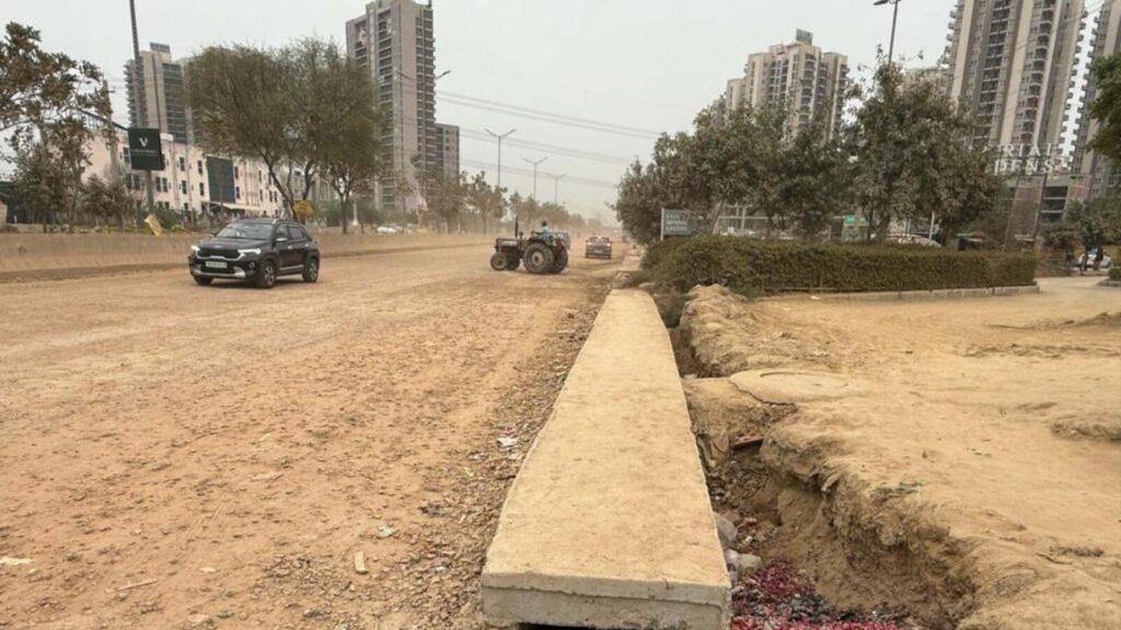 Residents struggle with potholes, dust on key Gurugram Sector 102 road