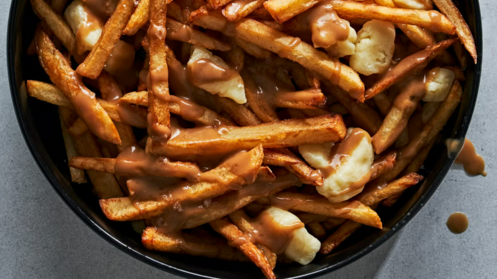 Poutine Day: Make the perfect bowl of golden fries, gooey curds, and gravy dreams with this classic Canadian recipe
