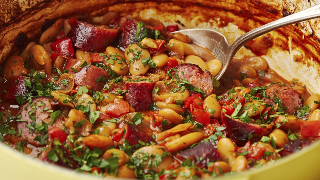 This smoky baked beans and sausages dish is the ultimate comfort food: Recipe