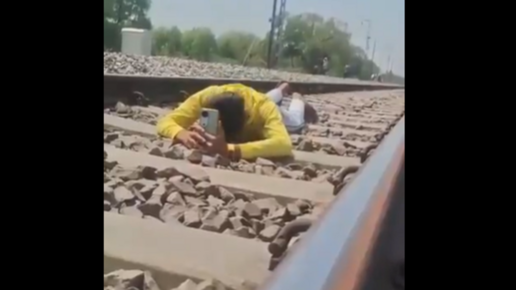UP man lies on railway track for Reels as train speeds over him, arrested after video goes viral | Trending