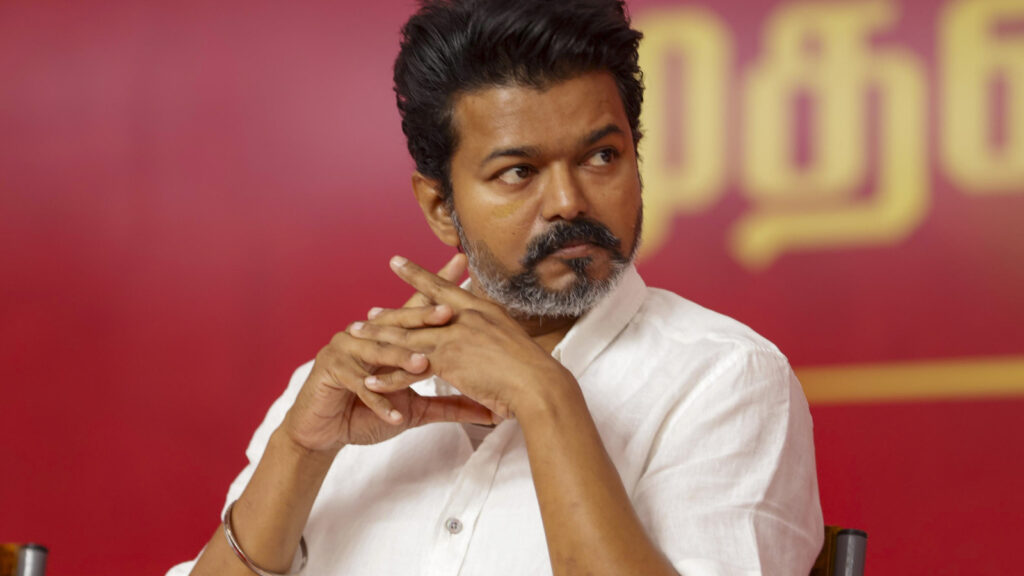 Vijay looks shocked as fan dramatically jumps down a tree to meet him at rally; internet jokes he recreated this scene