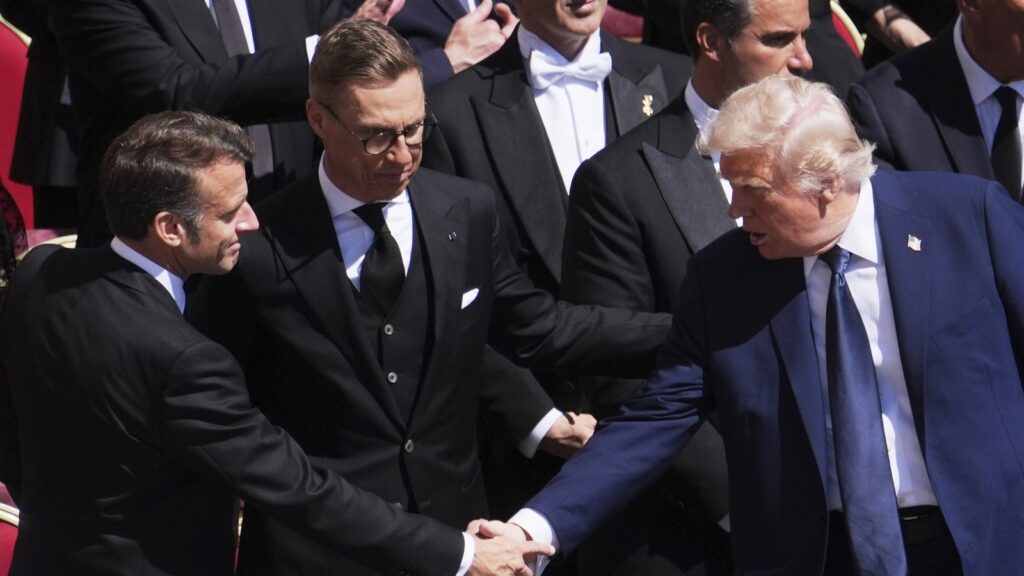 What did Donald Trump say during handshake with Emmanuel Macron at Pope’s funeral? Lip reader reveals details