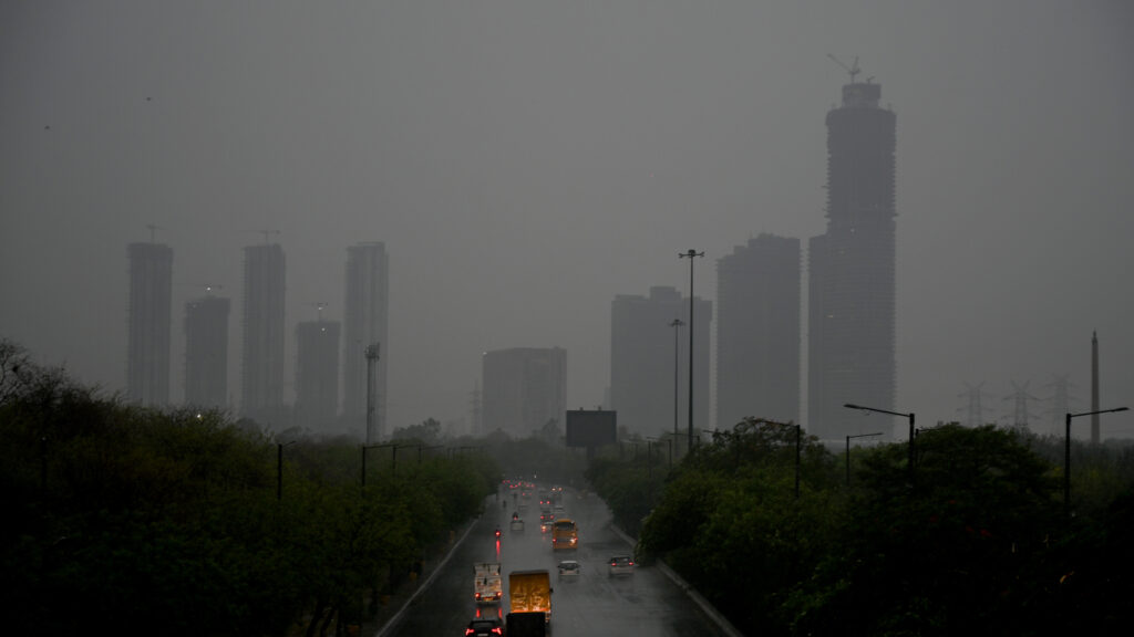 Delhiites brave waterlogged roads, traffic jams as heavy rain hits NCR | Pics